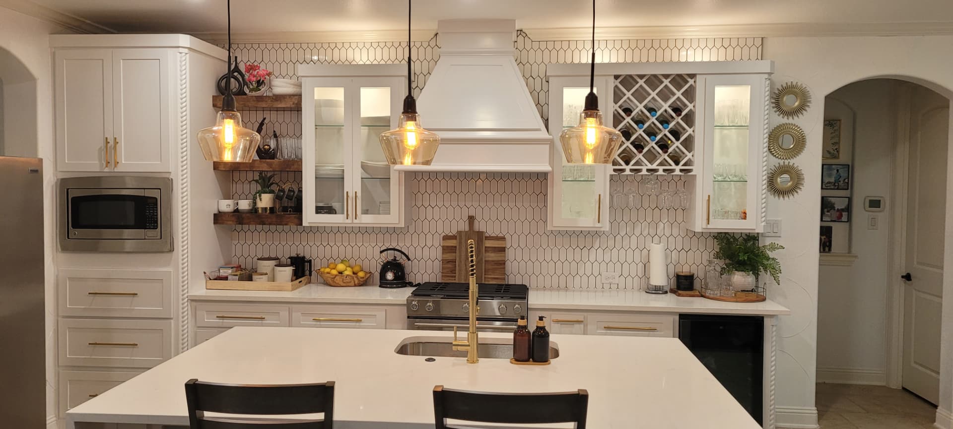 Full kitchen remodel with white cabinetry and new counters