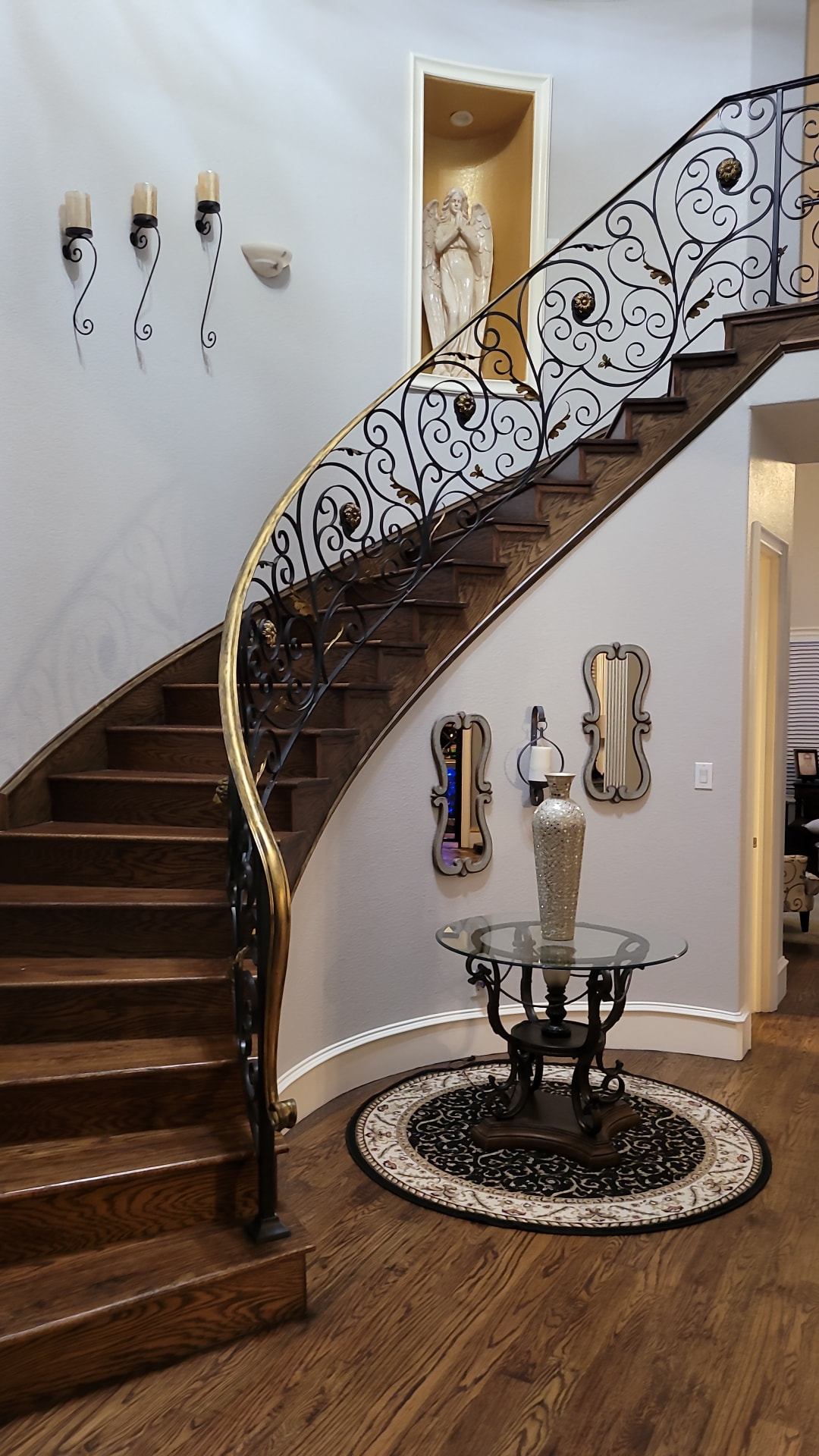 Wood staircase with custom wrought-iron railing