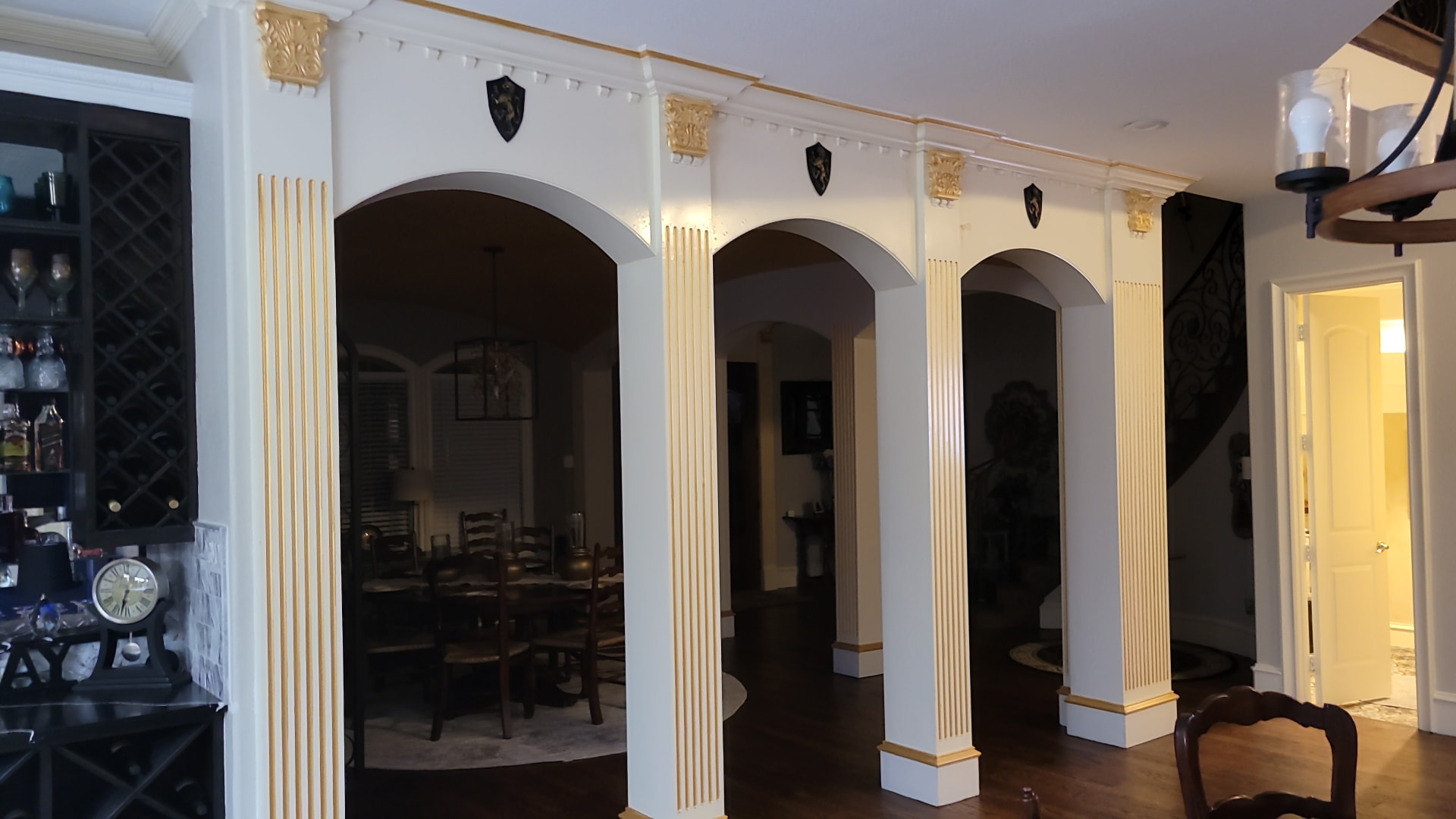 Arched openings with columns and trim work